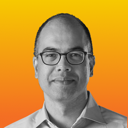 Sanjit Biswas in grayscale, against a vibrant orange-yellow gradient background.