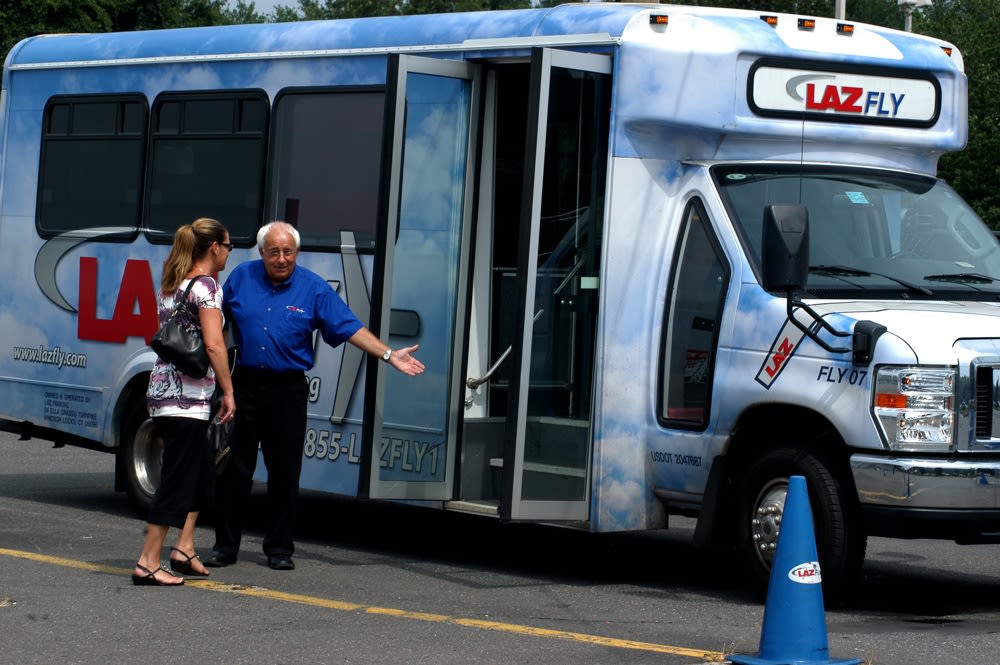Bus driver welcoming passenger