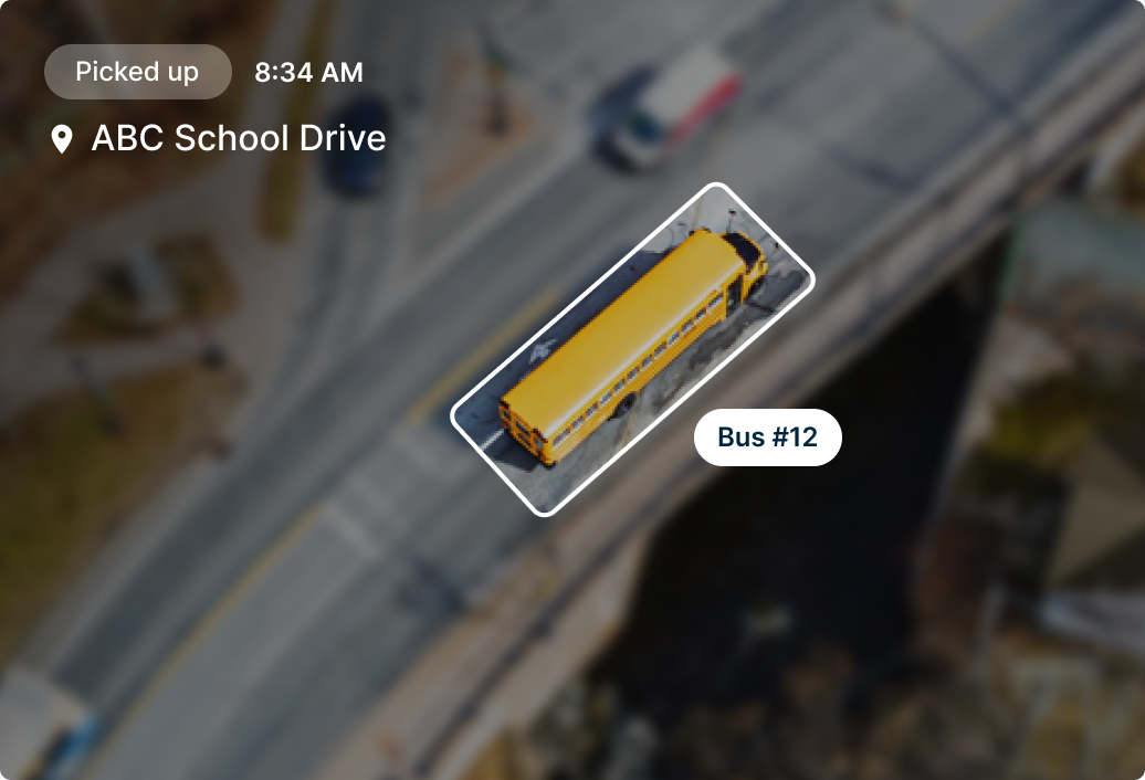 Aerial view of yellow school bus #12 on ABC School Drive, picked up at 8:34 AM, highlighted on tracking map.