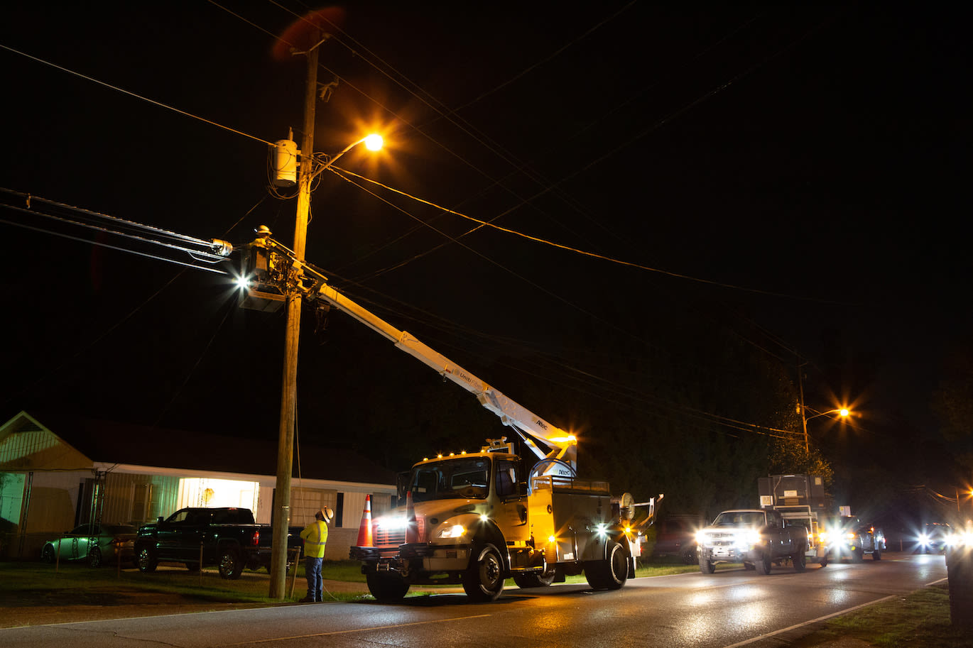 Utility workers at night