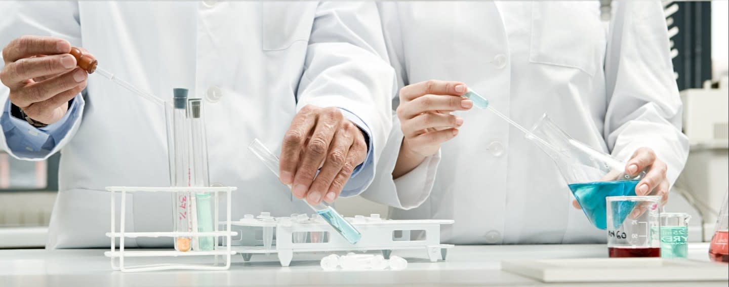 2-scientists-side-by-side-in-a-lab 2-scientists-side-by-side-in-a-lab