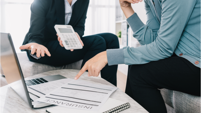 Insurance-Agent-Discussing-Insurance-With-Client Insurance-Agent-Discussing-Insurance-With-Client