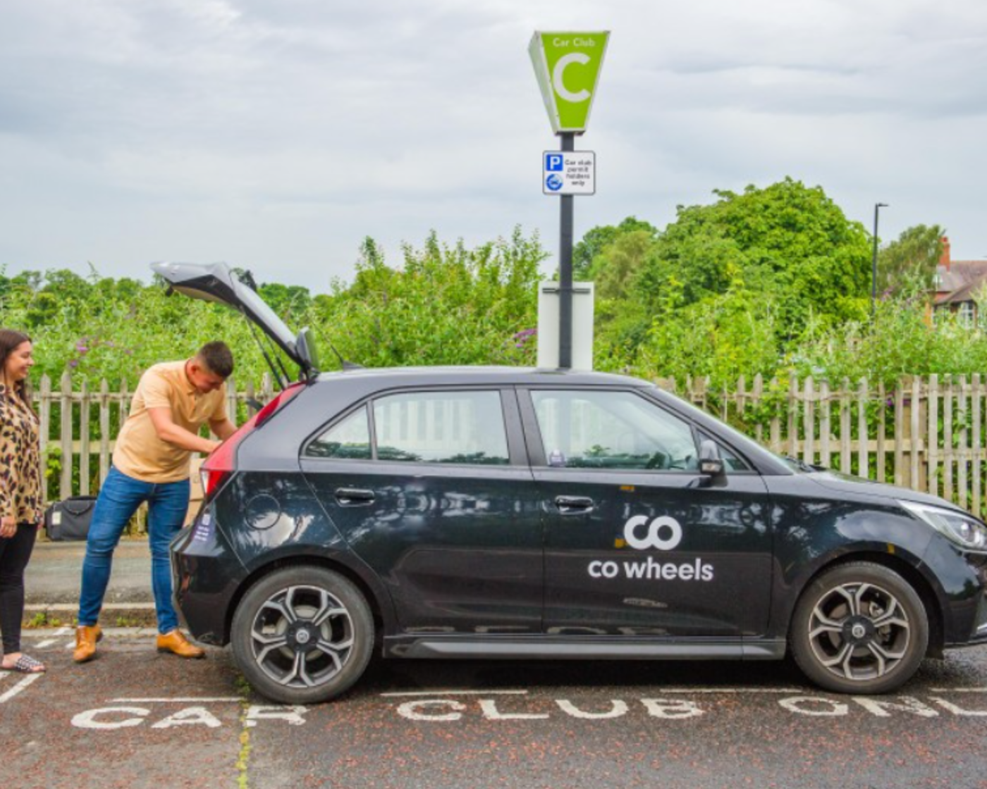 Electric car charging at a co wheels charger