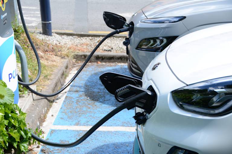 Two electric vehicles charging
