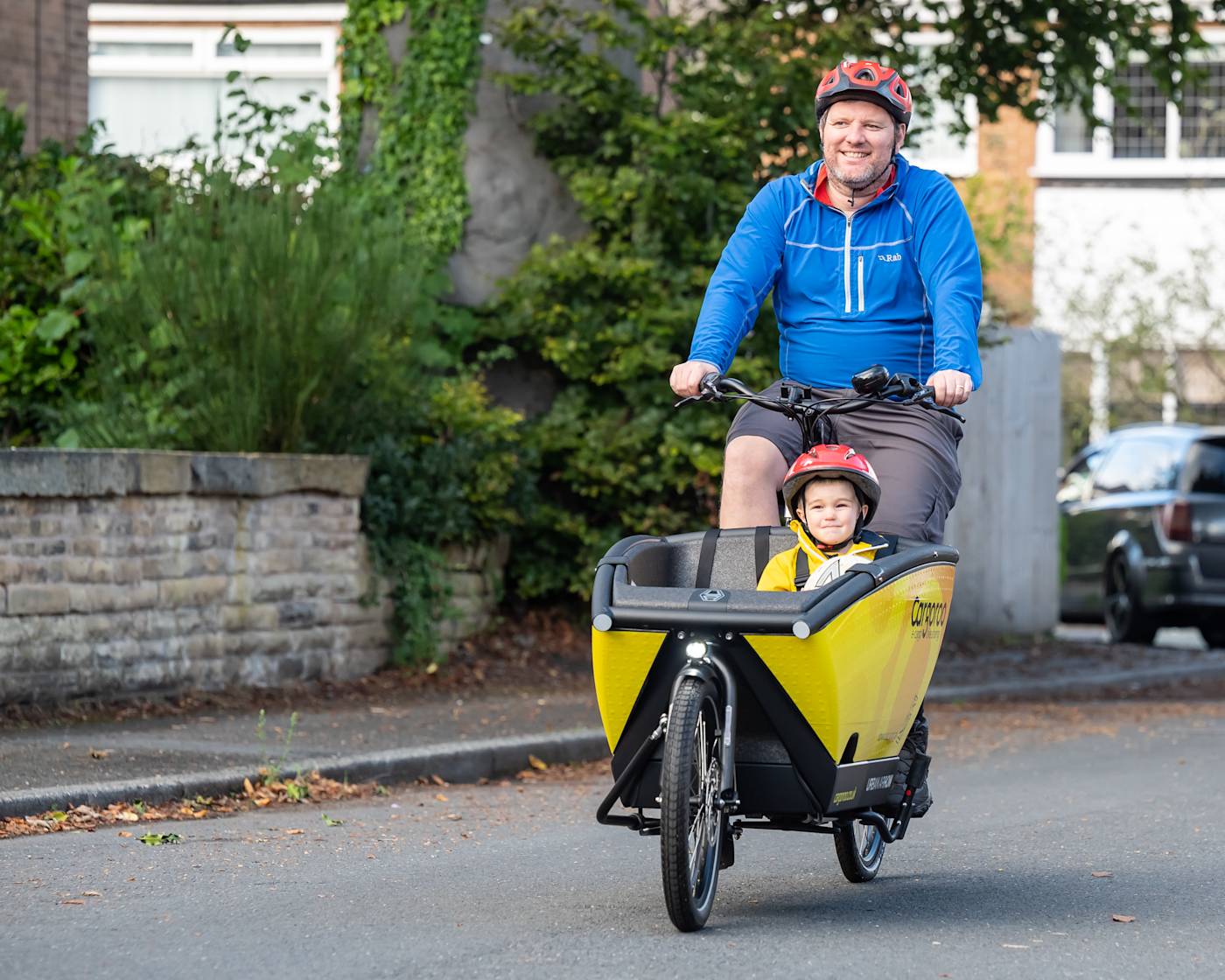 Cargoroo man and boy on eCargo bike in Manchester
