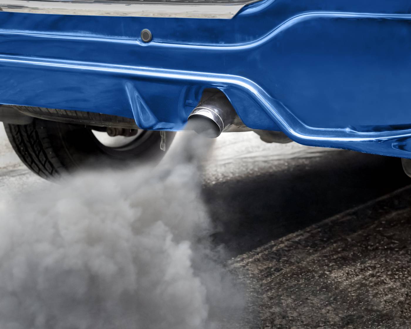 Close-up of blue car exhaust and fumes
