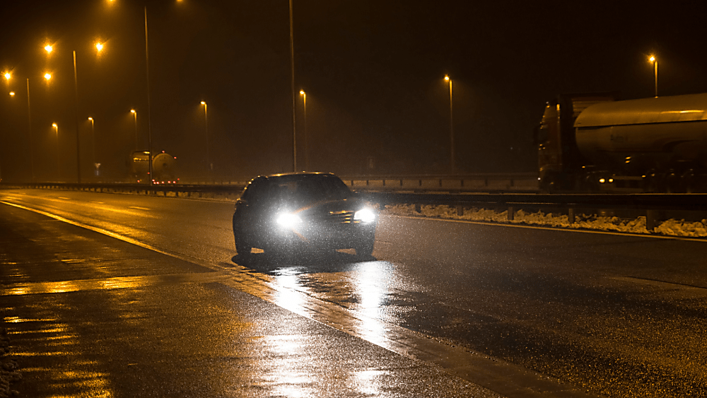 Car driving safely due to chance of black ice