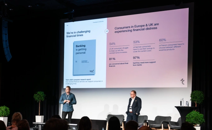 This image depicts Vesa Moisio and Martti Hakala speaking on stage at the Nordic Banking Forum event in Helsinki, 2023.