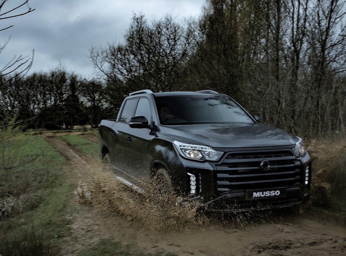 Ssangyong Musso driving off road in mud