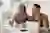 Image - two people at table in front of laptop looking at paperwork