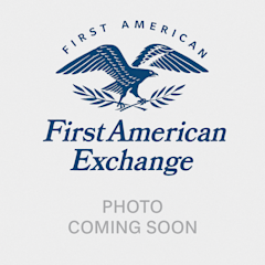 First American Exchange logo featuring a blue eagle with spread wings holding olive branches, with "PHOTO COMING SOON" text below.