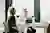 Image - two women laughing at table with laptops