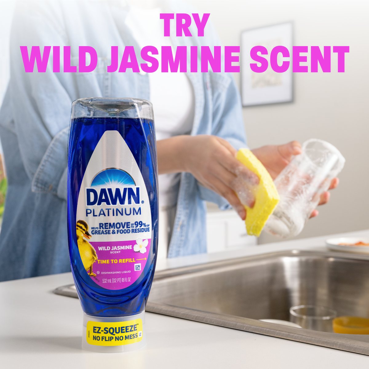 Dawn Platinum Wild Jasmine dish soap bottle with a person washing dishes in the background, highlighting grease removal benefits and scent