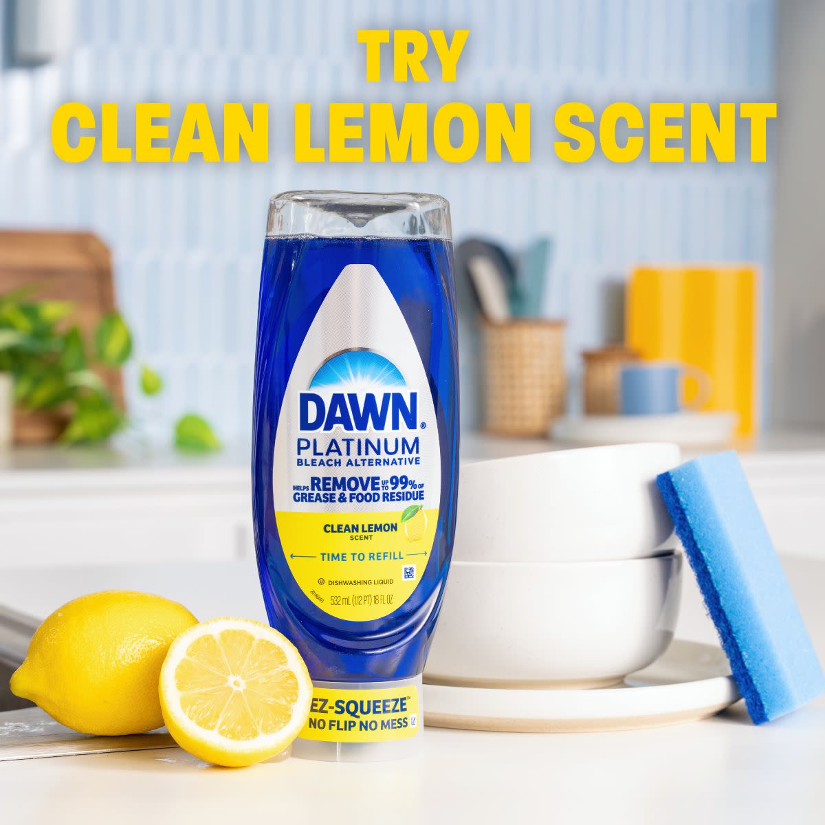 Dawn Platinum dishwashing liquid bottle with clean lemon scent alongside fresh lemons and kitchen items in a bright setting