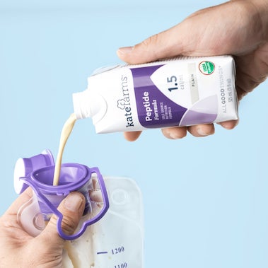 photo of peptide 1.5 formula pouring into tube feeding bag
