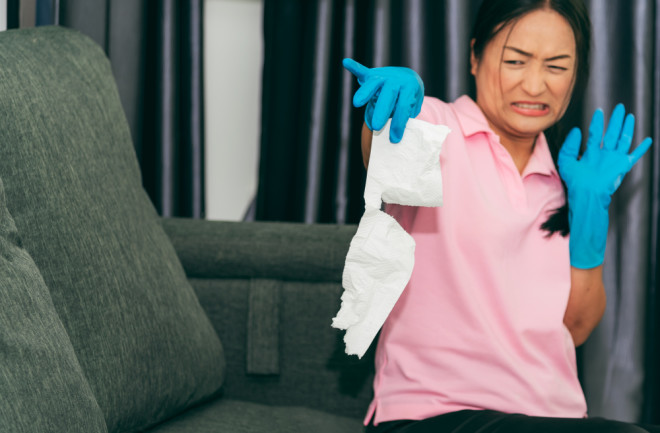 woman disgusted tissue - shutterstock