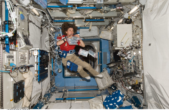Cady Coleman wired up for a space-medicine experiment aboard the International Space Station during Expedition 26 in 2011. (Credit: NASA)