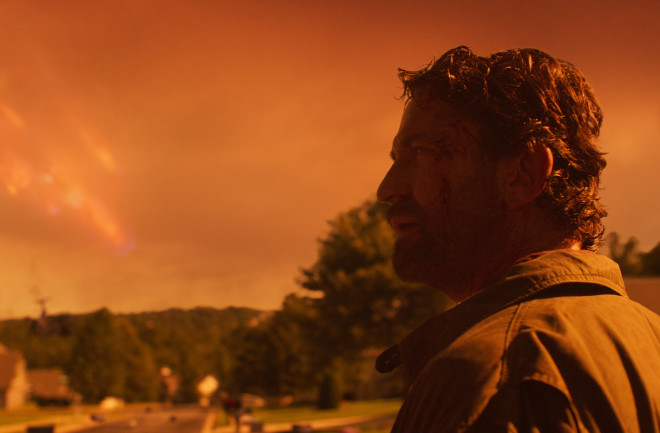 Interstellar Comet Clark looms behind a world tinged orange by fire in the new disaster movie "Greenland." (Credit: STXfilms)