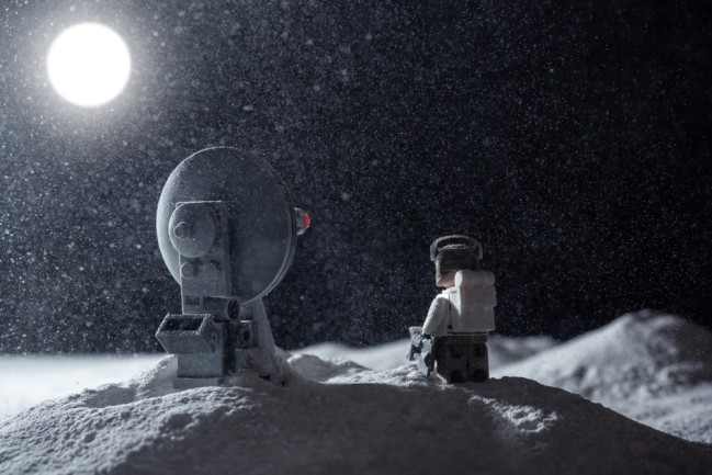 Lego figurine in space on the moon
