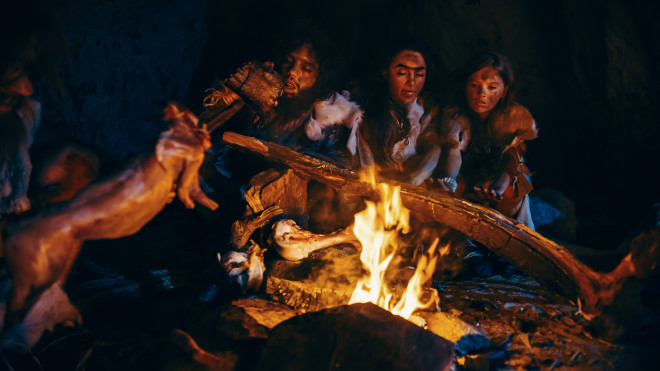 Depiction of Neanderthals communicating around a fire