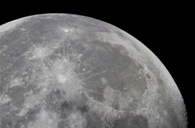 The surface of the moon scattered with craters from meteorite collisions.