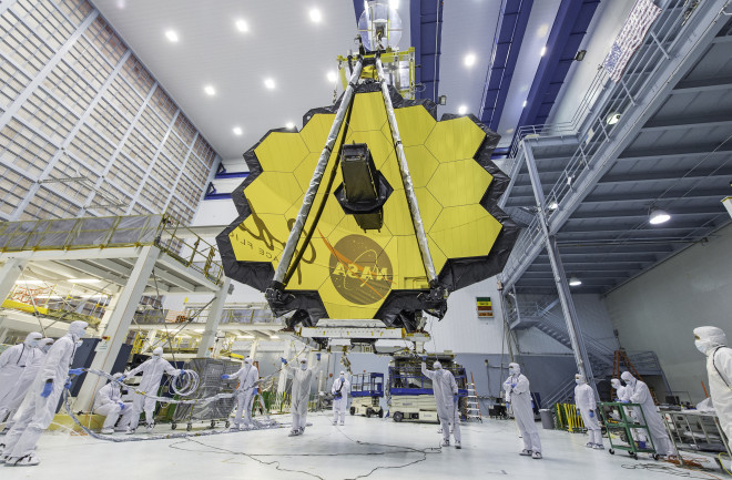 James Webb Space Telescope mirror with scientists