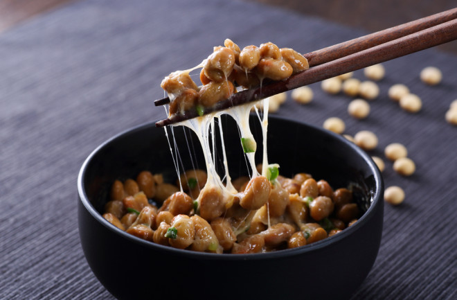 bowl of natto with chopsticks - shutterstock 1140852635