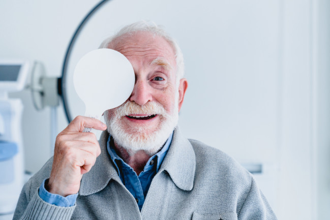 older man taking an eye exam