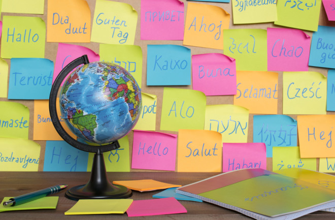 different languages on post it notes different colors globe