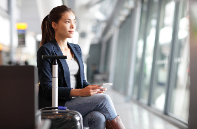 Woman traveling and waiting at an airport