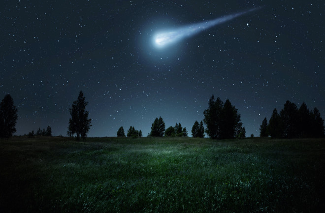 Night scene with a comet, asteroid, meteorite flying to Earth. Night landscape. Elements of this image furnished by NASA.