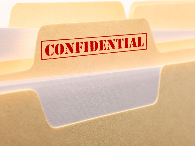 Manilla folder with a red Confidential stamp