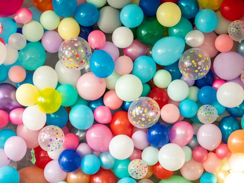 Pile of small multicolored balloons.