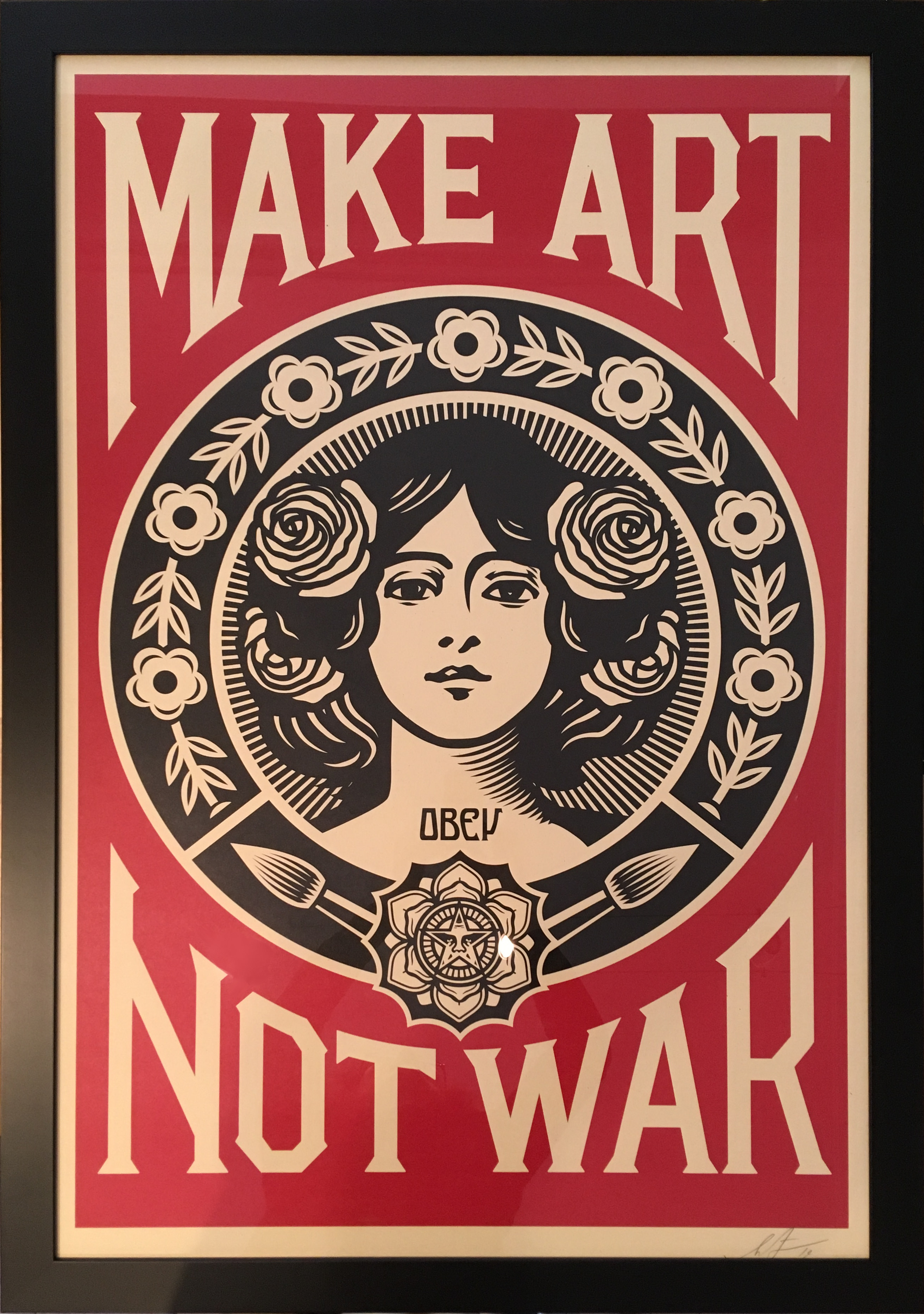 Cadrine : Encadrement sur-mesure d'une affiche "Make Art Not War"