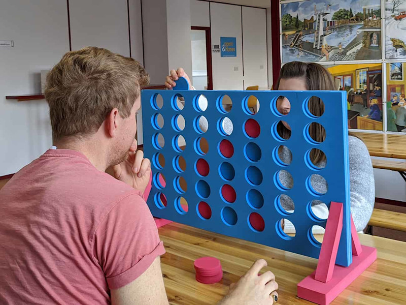 People playing a giant game of Connect 4