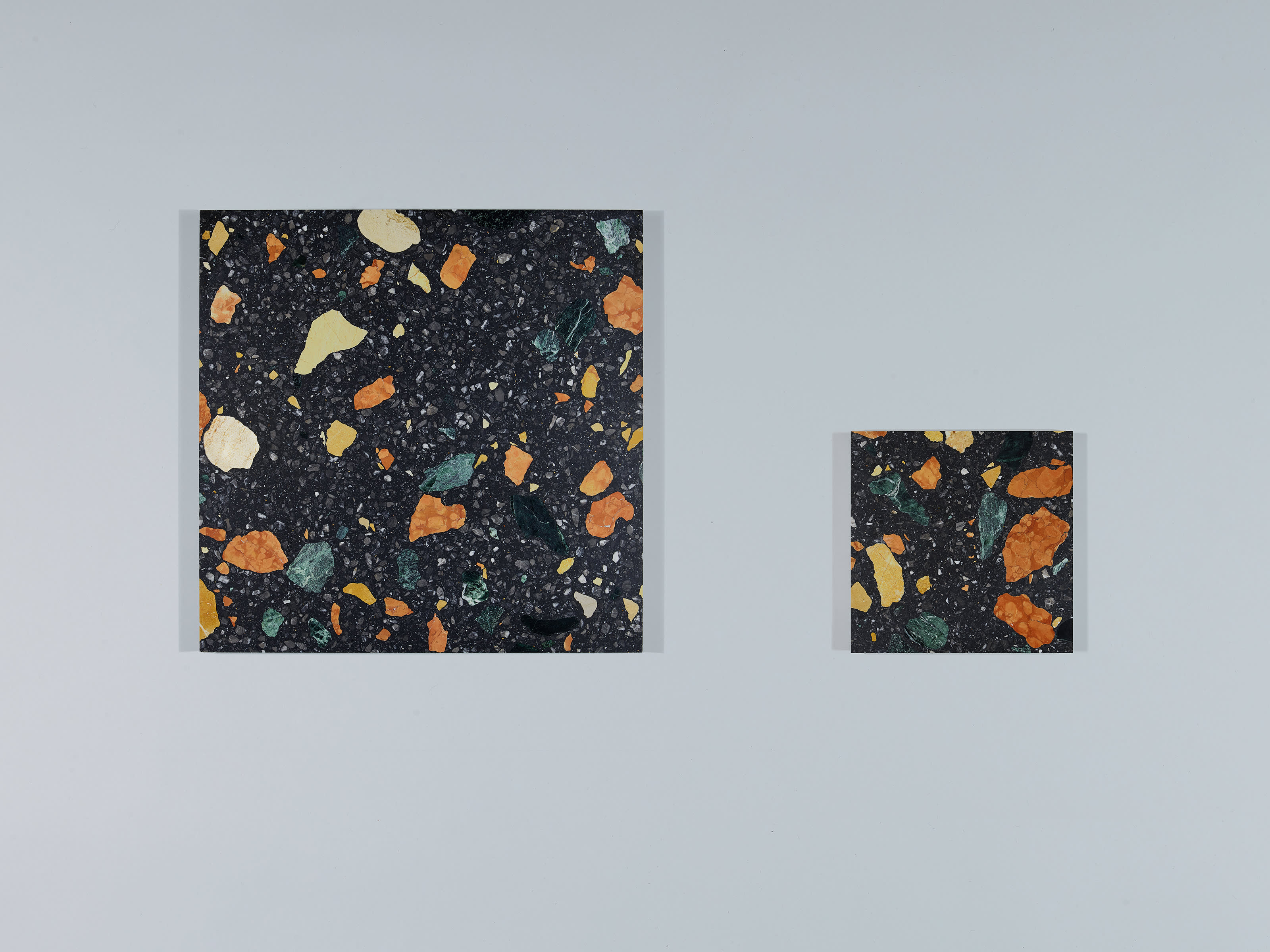 MARMOREAL BLACK TILES IN TWO SIZES, 600 ✕ 600MM AND 300 ✕ 300MM.