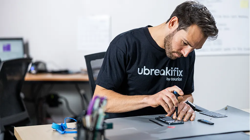 uBreakiFix expert repairing a Google Pixel in the shop