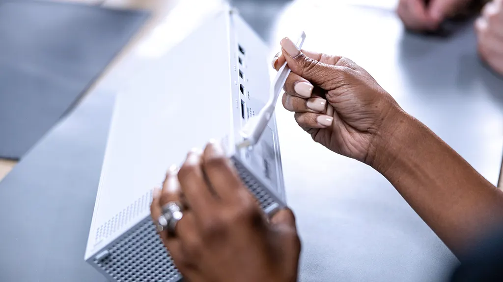 A uBreakiFix by Asurion technician repairing an overheating Xbox Series S