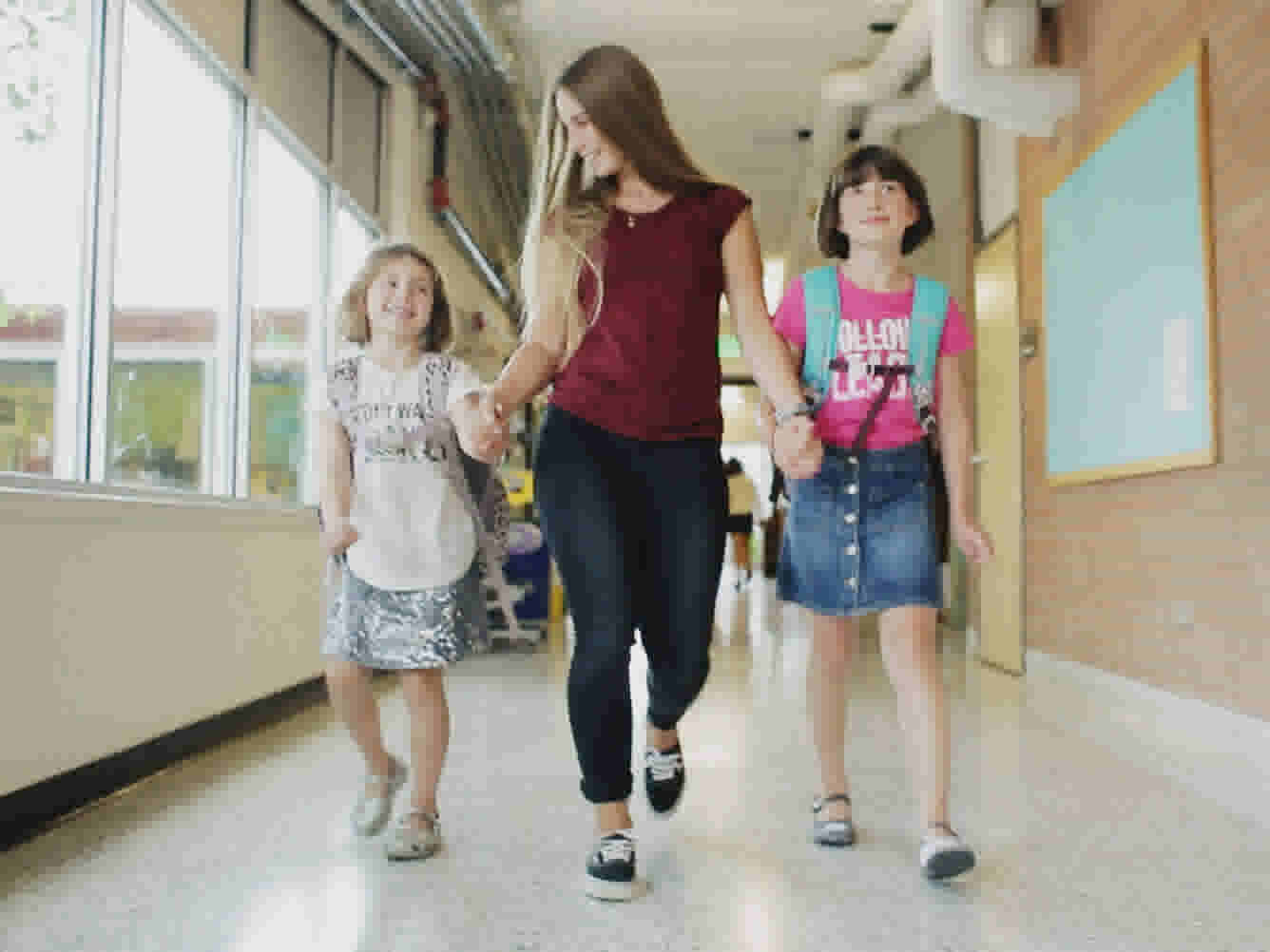 Flo picks up the kids at school and take them home.