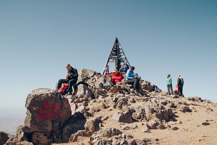 Taking a break on a rocky summit
