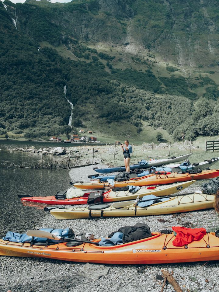 Line of kayaks on the shore