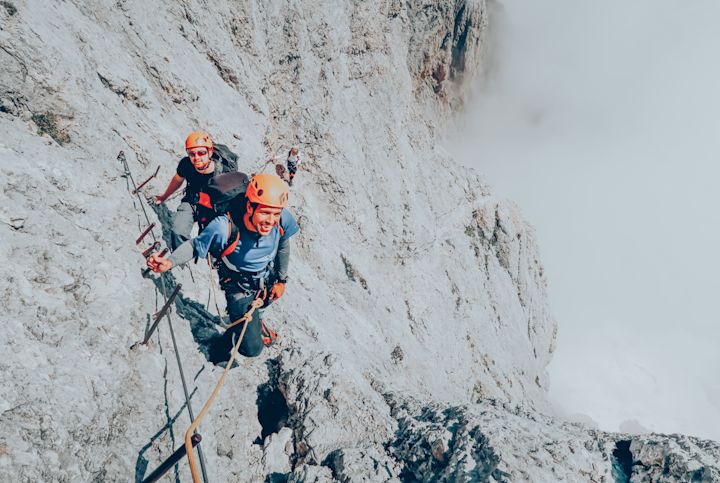 Climbing sheer rockface