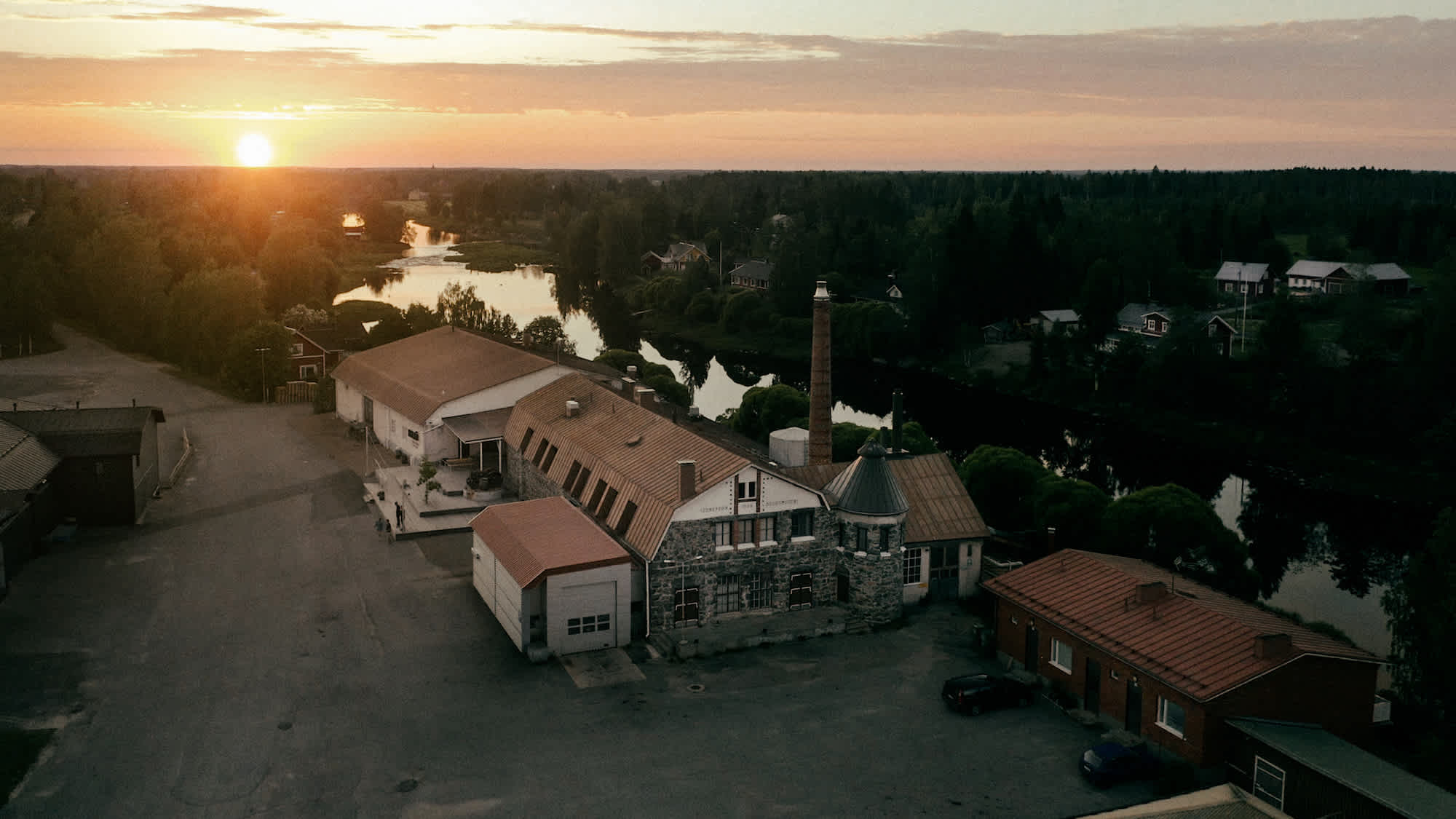 Image of Kyrö Distillery from above during sunset.