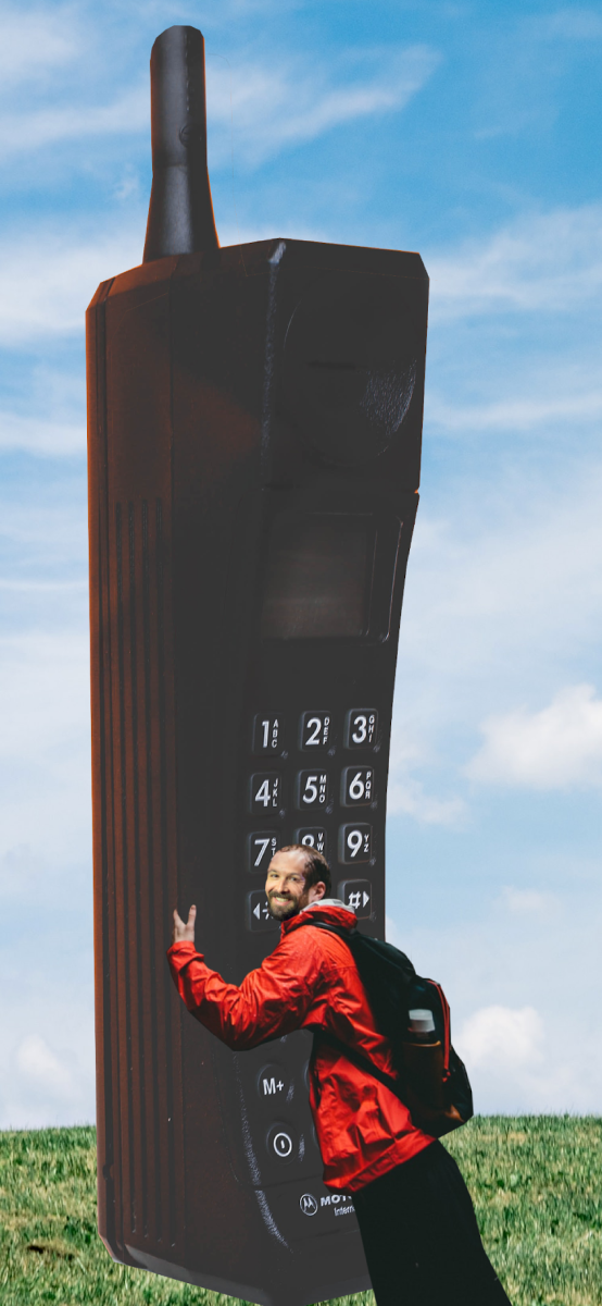 Hugging a giant 90s era cell phone