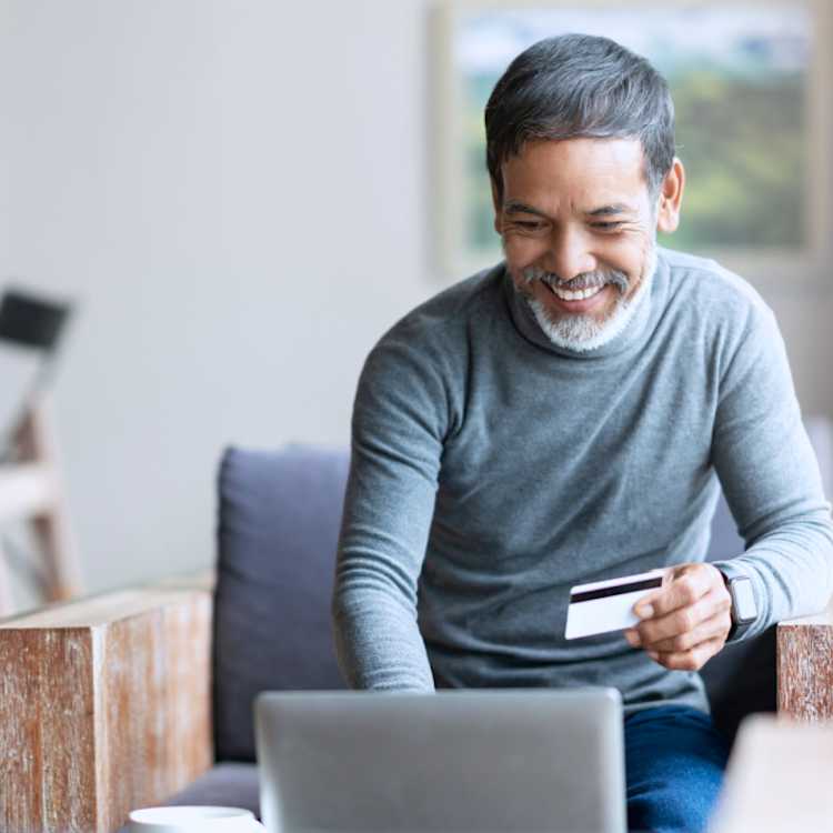 Figure of man paying bill