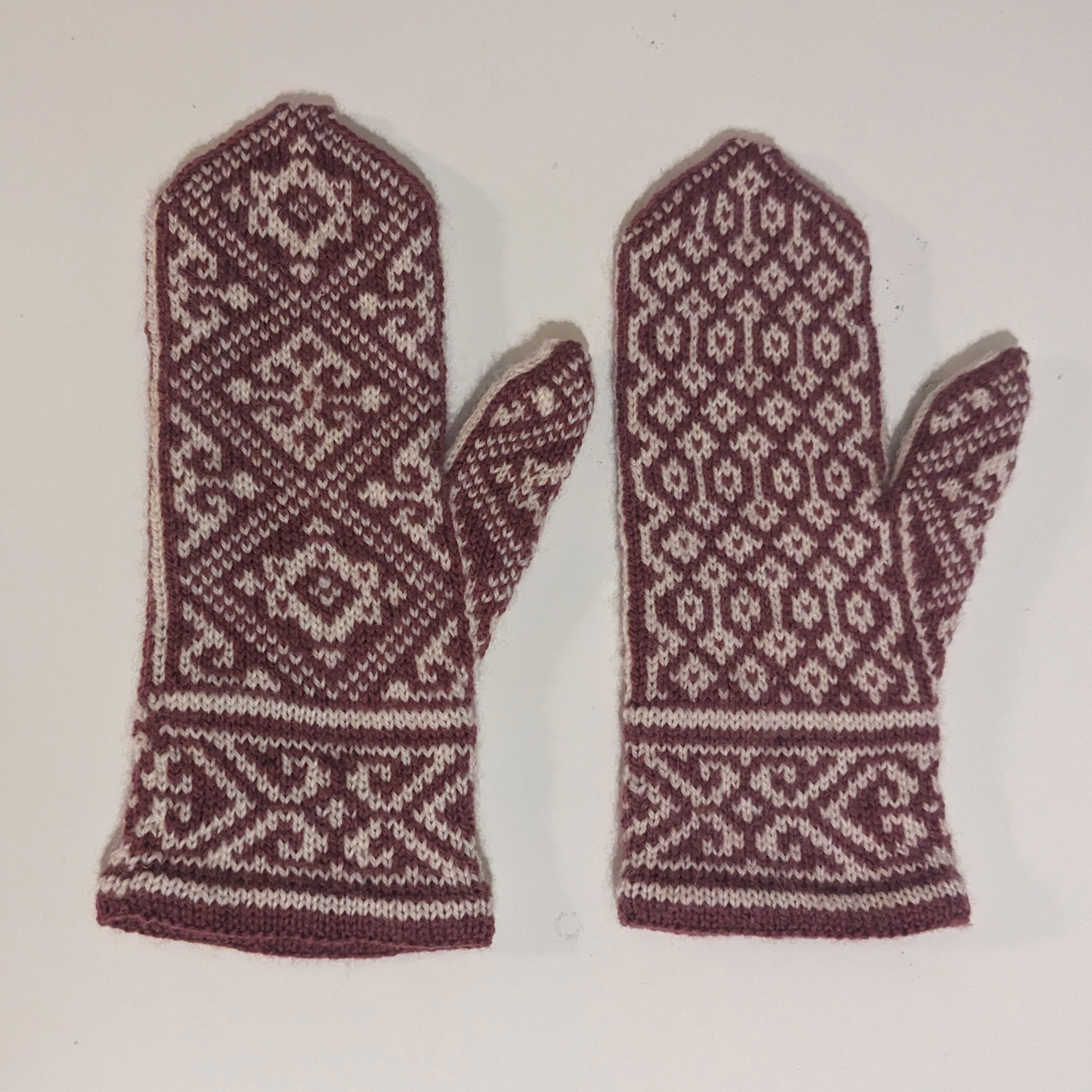 Purple and white patterned handknit mittens