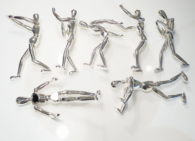 Metal plated human sculpture in different poses