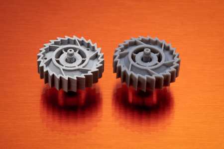 Two gears printed with different 3D printing technology
