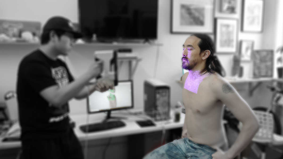 A man 3D scanning steve aoki