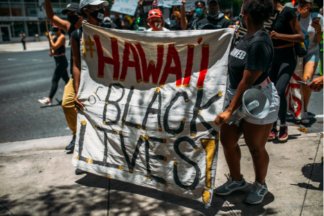 Black Lives Matter protesters marching in Honolulu, with a sign that reads “HAWAII FOR BLACK LIVES”